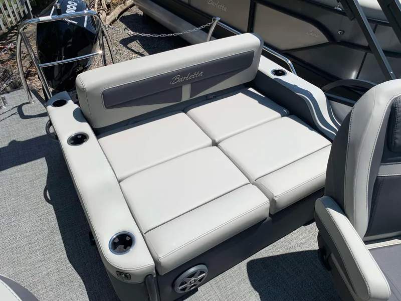 Slide: The Image of 2025 Barletta Cabrio 20UC boat seating with cup holders and sleek design. - 10