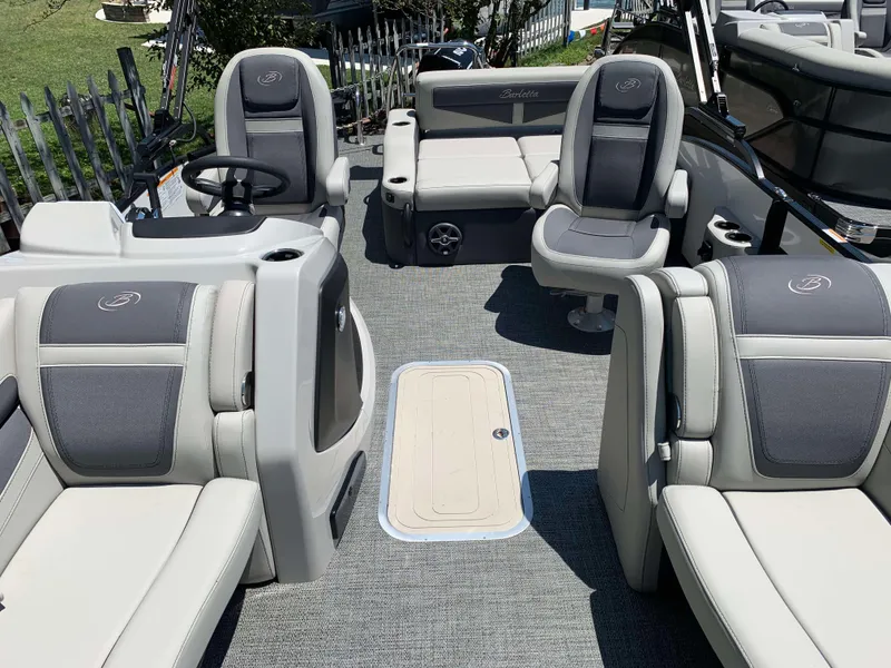 Slide: The Image of 2025 Barletta Cabrio 20UC pontoon boat interior with plush seating and modern design. - 12