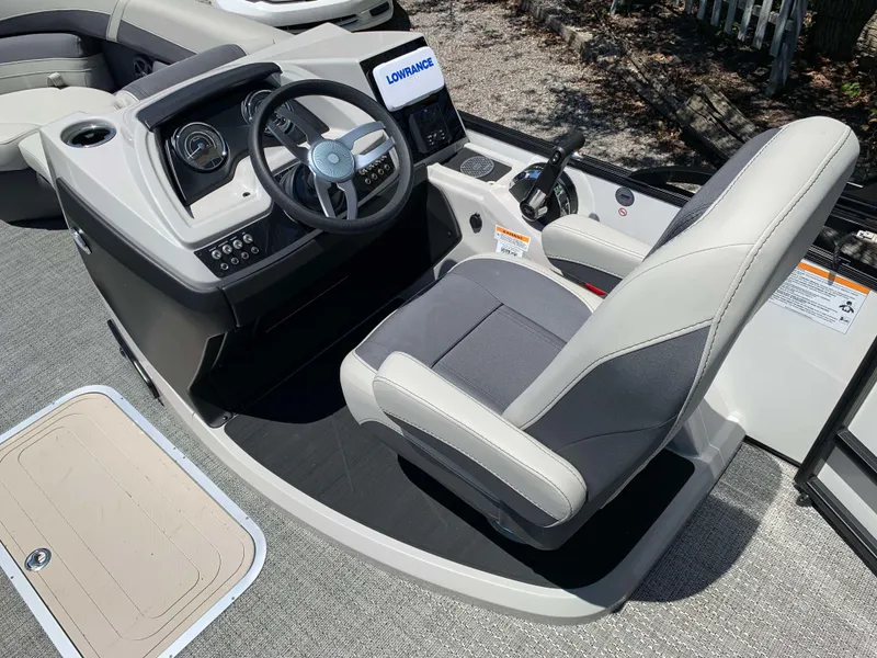 Slide: The Image of 2025 Barletta Cabrio 20UC boat helm with steering wheel and control panel. - 13