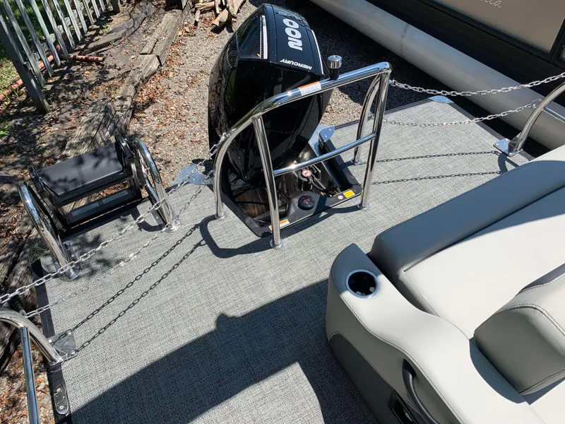 Slide: The Image of 2025 Barletta Cabrio 20UC boat deck with motor and seating area. - 3