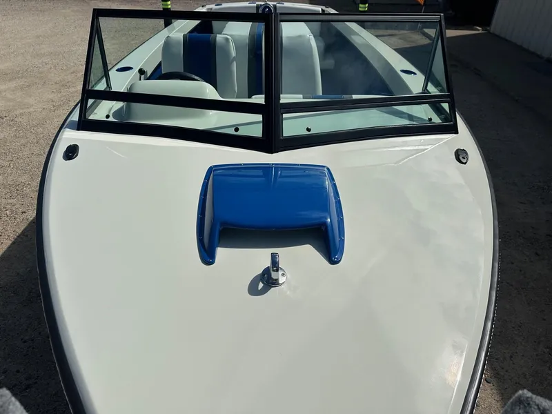 Slide: The Image of 1977 Correct Craft Ski Nautique boat with blue accents and windshield. - 10