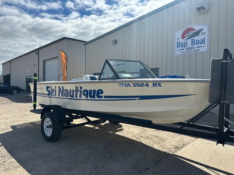 Slide: The Image of 1977 Correct Craft Ski Nautique boat on trailer at Boji Boat Brokers. - 2