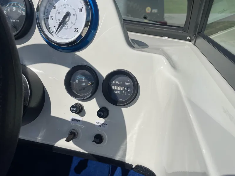Slide: The Image of 1977 Correct Craft Ski Nautique dashboard with gauges and switches. - 20