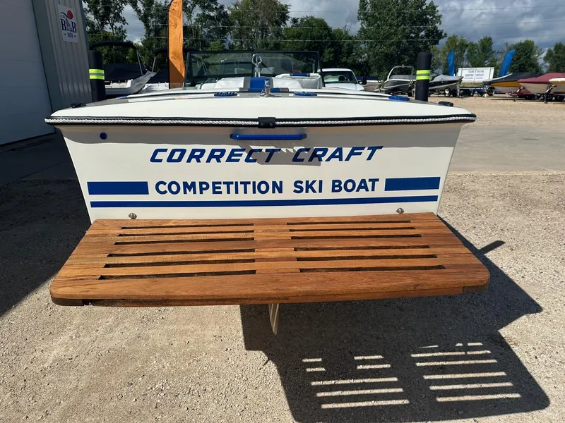 Slide: The Image of 1977 Correct Craft Ski Nautique competition ski boat with wooden platform. - 4