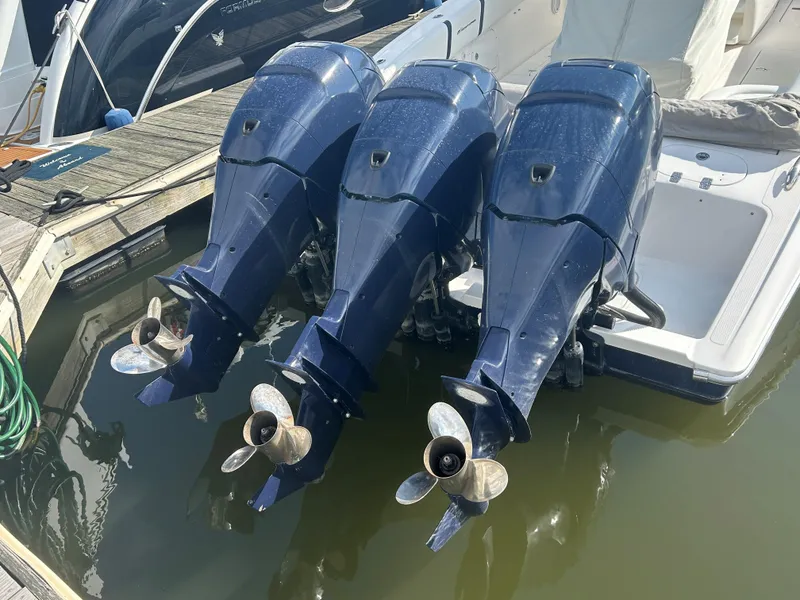 Slide: The Image of Triple outboard motors on a 2008 Midnight Express 37 boat. - 14