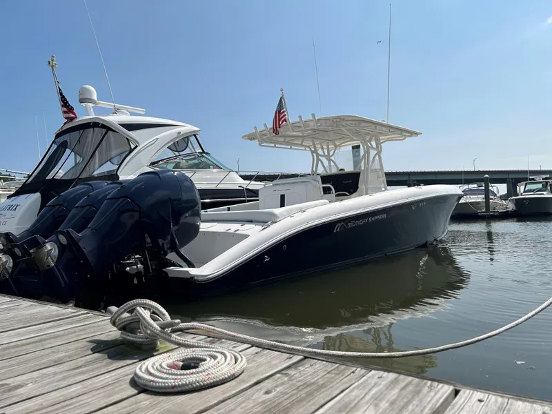 Slide: The Image of 2008 Midnight Express 37 boat docked at marina, sunny day. - 18