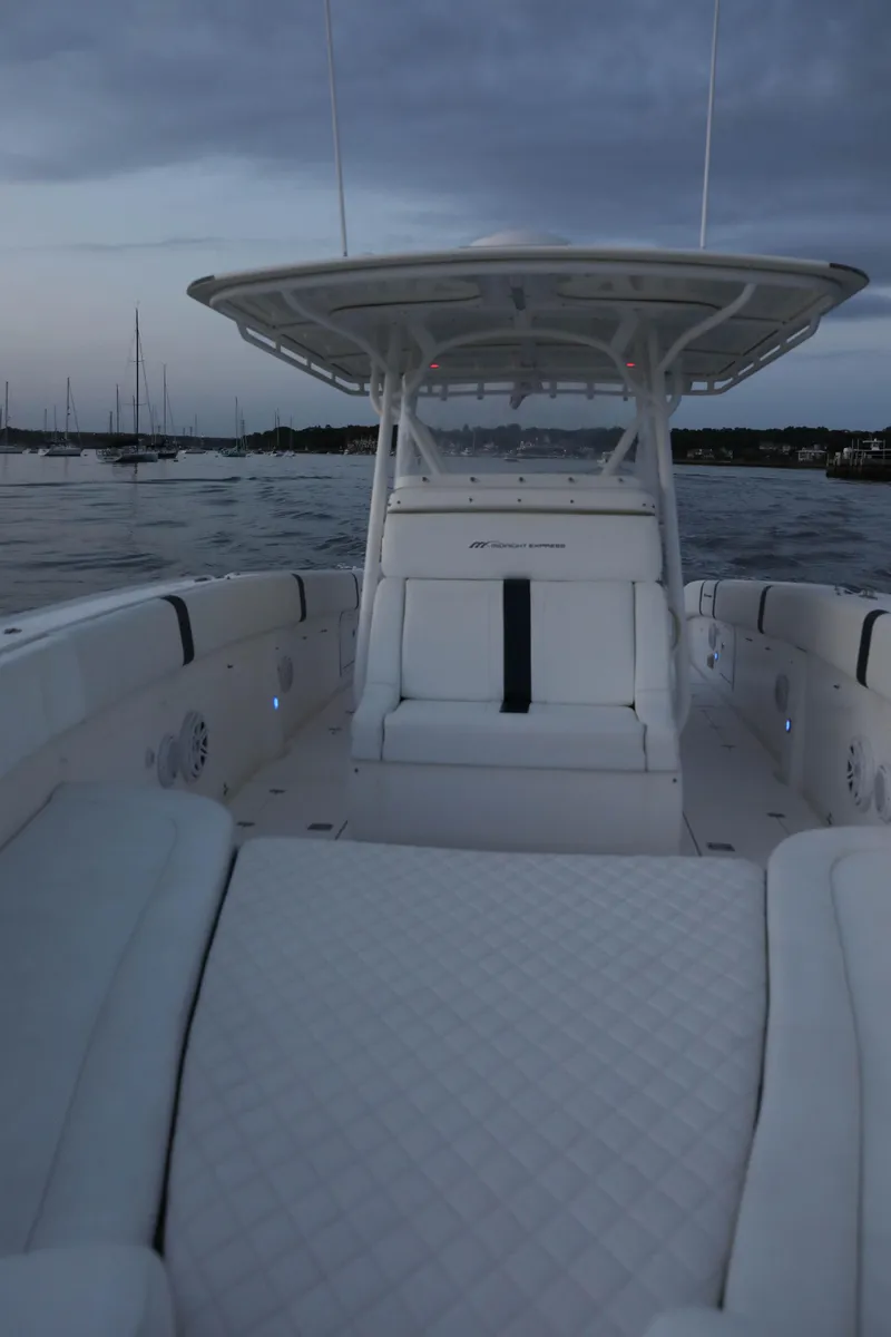 Slide: The Image of 2008 Midnight Express 37 boat on calm water at dusk. - 27