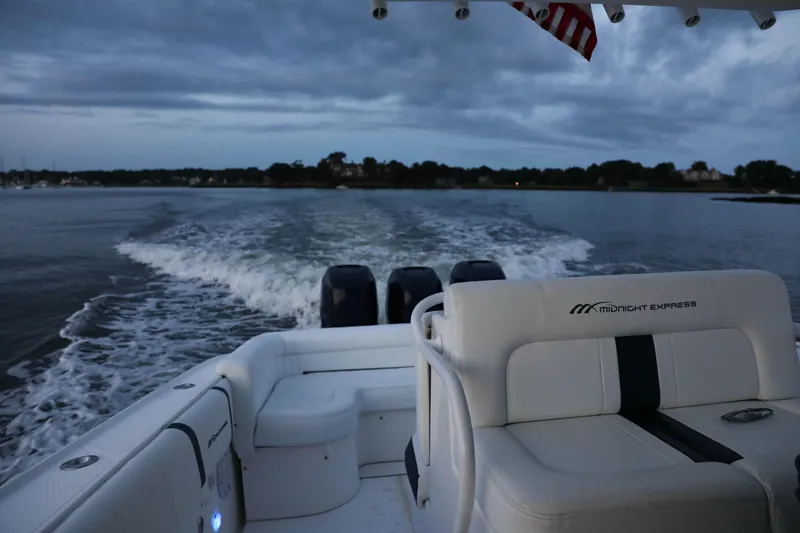 Slide: The Image of Midnight Express 37 boat cruising on water at dusk, 2008 model. - 28