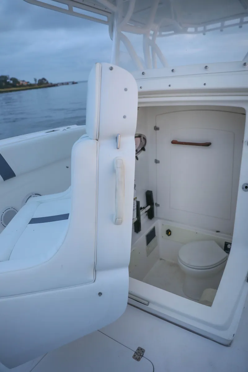 Slide: The Image of 2008 Midnight Express 37 boat interior with compact marine toilet. - 32