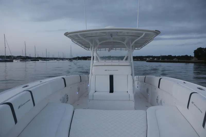 Slide: The Image of 2008 Midnight Express 37 boat on calm water at dusk. - 5
