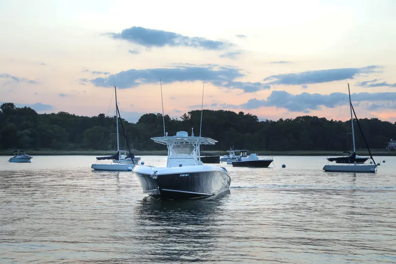 Slide: The Image of Midnight Express 37 boat on serene water at sunset, 2008 model. - 7