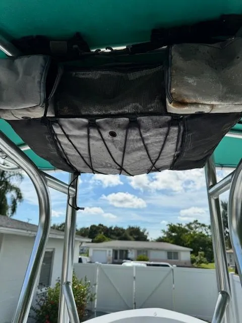 Slide: The Image of 2016 Sportsman Island Reef 19 Center Console boat with overhead storage, sunny day. - 11