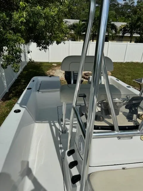 Slide: The Image of 2016 Sportsman Island Reef 19 Center Console boat in a yard setting. - 13