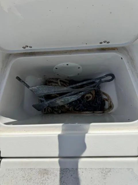 Slide: The Image of Anchor and rope in storage compartment of 2016 Sportsman Island Reef 19 Center Console boat. - 22