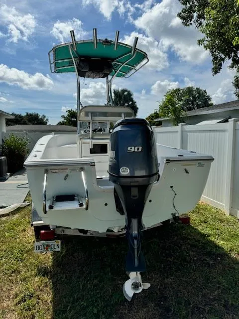 Slide: The Image of 2016 Sportsman Island Reef 19 Center Console boat with 90 HP outboard motor. - 25