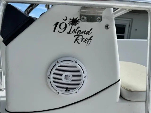 Slide: The Image of 2016 Sportsman Island Reef 19 Center Console boat detail with speaker and logo. - 9