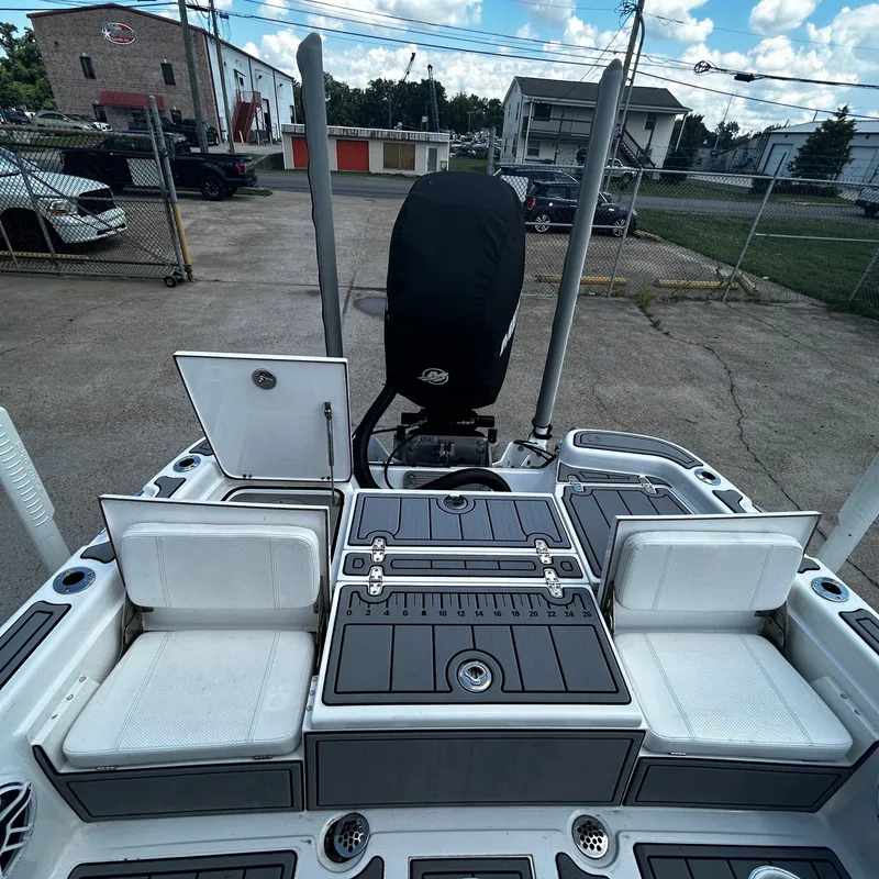 Slide: The Image of 2021 BlackJack 256 Bay boat interior with seating and storage compartments. - 10