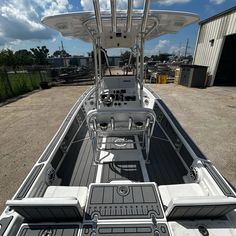 Slide: The Image of 2021 BlackJack 256 Bay boat with sleek interior and advanced controls. - 11