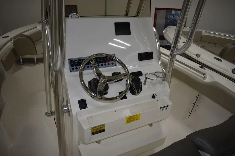 Slide: The Image of 2024 Key West 239 FS boat console with steering wheel and controls. - 10