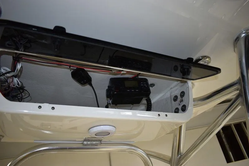 Slide: The Image of 2024 Key West 239 FS boat console with electronic equipment and wiring. - 11