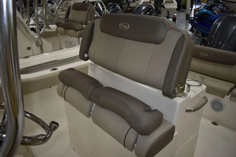 Slide: The Image of 2024 Key West 239 FS boat seating with cushioned backrest and armrests. - 14