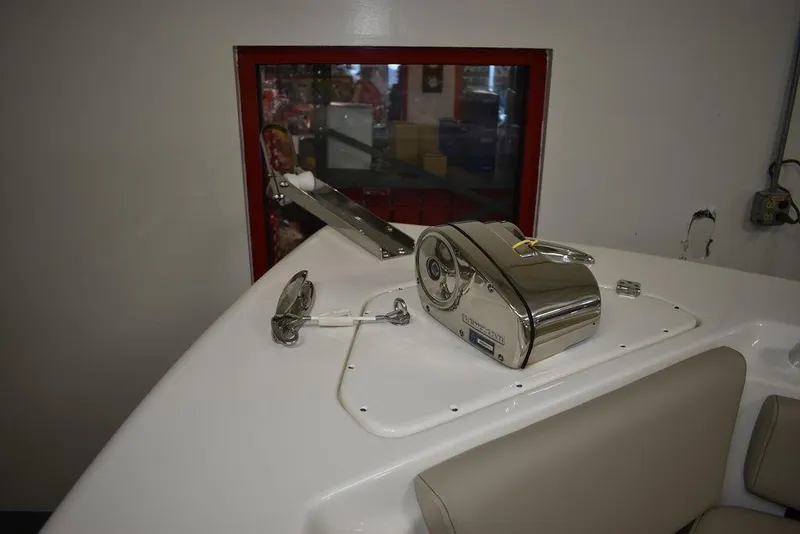 Slide: The Image of 2024 Key West 239 FS boat interior with anchor winch and seating. - 25