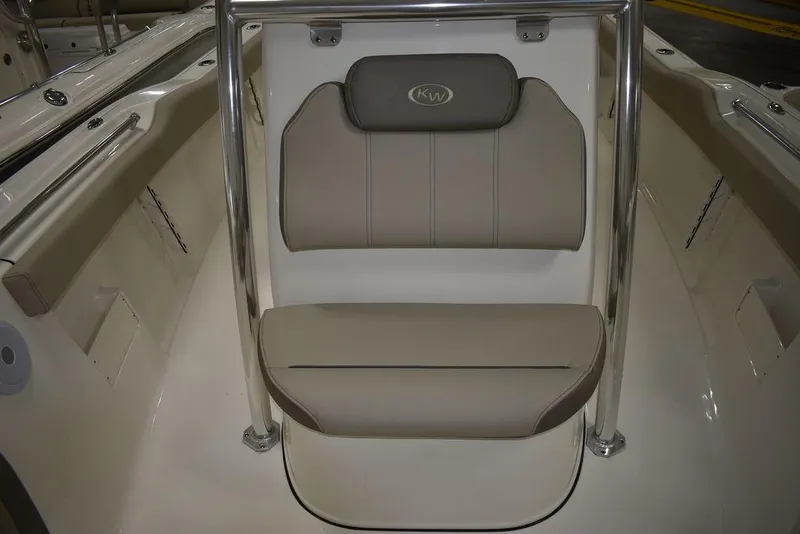 Slide: The Image of 2024 Key West 239 FS boat interior seating with beige cushions and stainless steel frame. - 26
