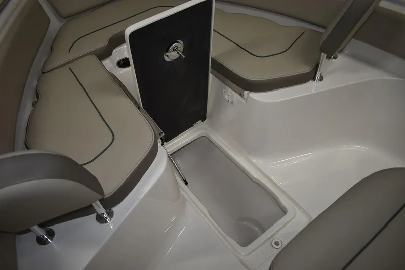 Slide: The Image of 2024 Key West 239 FS boat interior with storage compartment and cushioned seating. - 28
