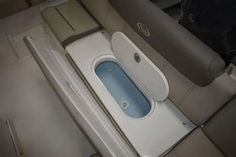 Slide: The Image of 2024 Key West 239 FS boat seating with built-in storage compartment. - 30