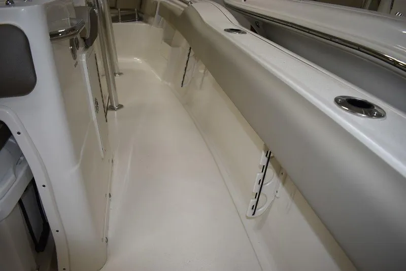 Slide: The Image of 2024 Key West 239 FS boat interior with sleek white deck and stainless steel accents. - 34