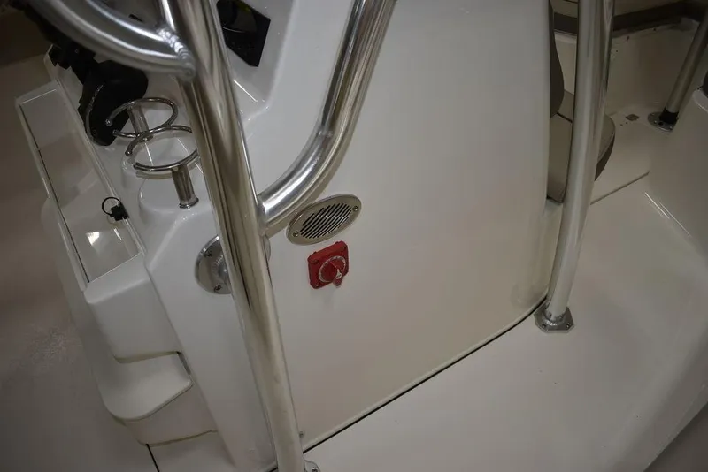 Slide: The Image of 2024 Key West 239 FS boat console with stainless steel railings and cup holders. - 35