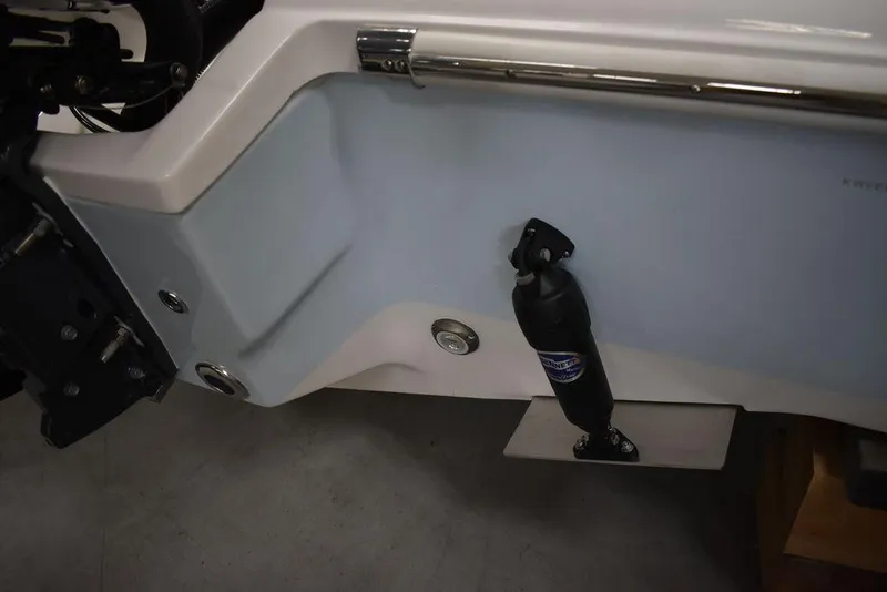 Slide: The Image of 2024 Key West 239 FS boat transom with hydraulic trim tab and stainless steel fittings. - 38