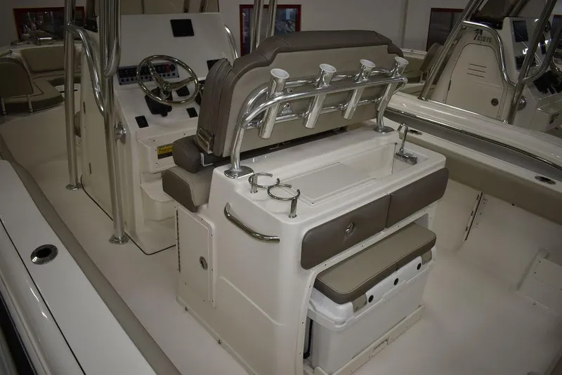 Slide: The Image of 2024 Key West 239 FS boat interior with seating and fishing rod holders. - 7