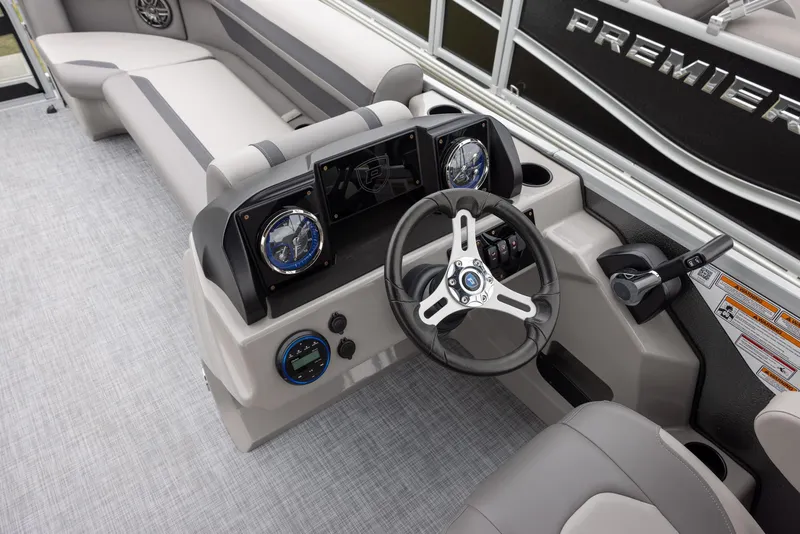Slide: The Image of 2025 Premier 220 Sunscape RF boat interior with modern steering console and seating. - 10