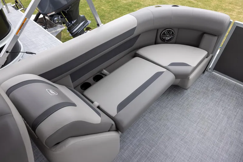Slide: The Image of 2025 Premier 220 Sunscape RF boat interior with gray seating and cup holders. - 11