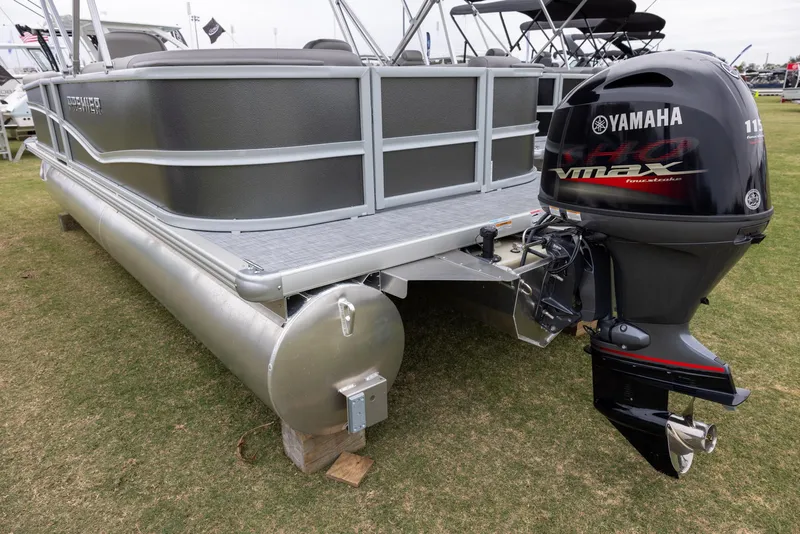 Slide: The Image of 2025 Premier 220 Sunscape RF pontoon boat with Yamaha outboard motor displayed on grass. - 3