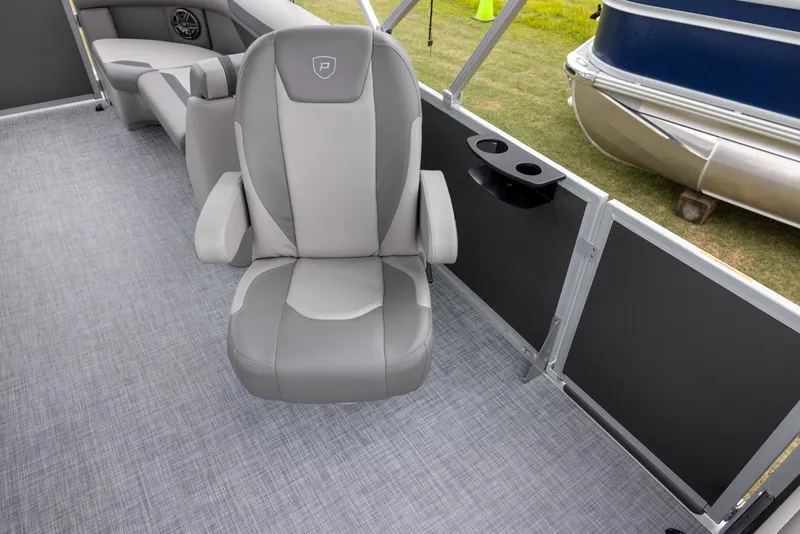 Slide: The Image of 2025 Premier 220 Sunscape RF boat interior with gray seating and carpet flooring. - 7
