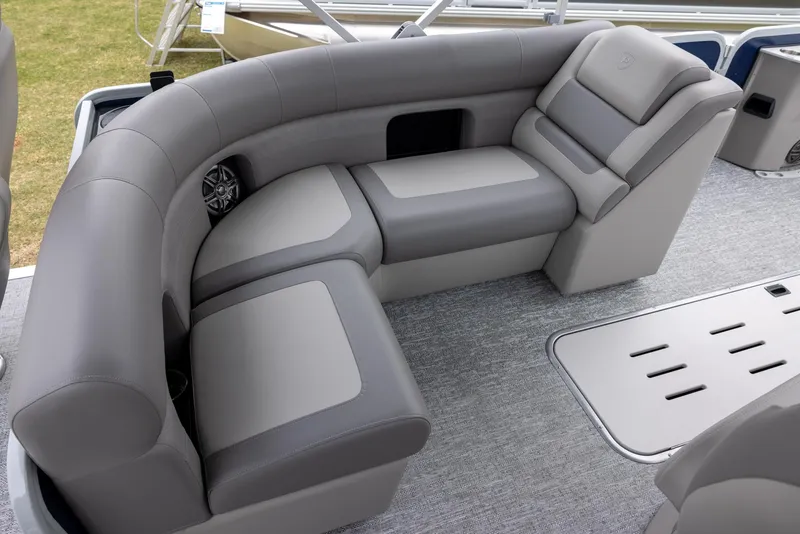 Slide: The Image of 2025 Premier 230 SunSation Angler boat interior with gray cushioned seating. - 10