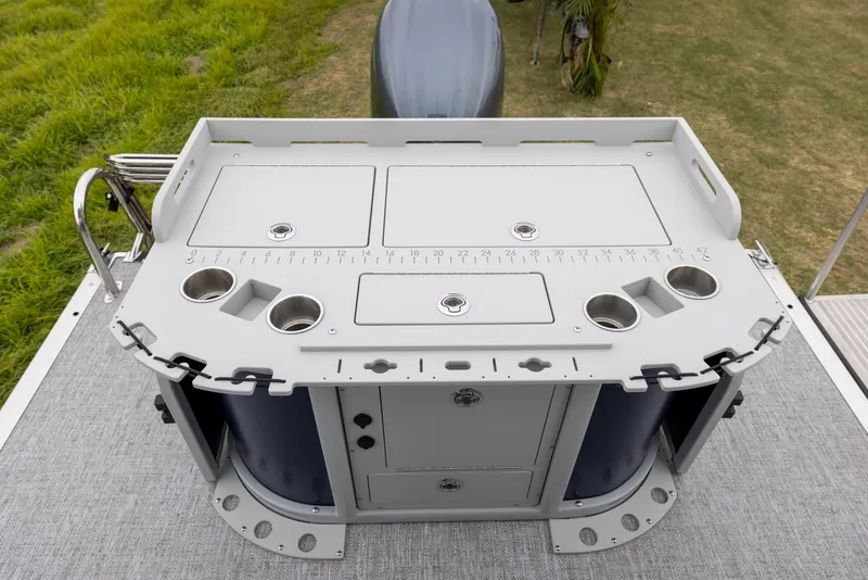 Slide: The Image of 2025 Premier 230 SunSation Angler fishing station with storage and cup holders. - 12