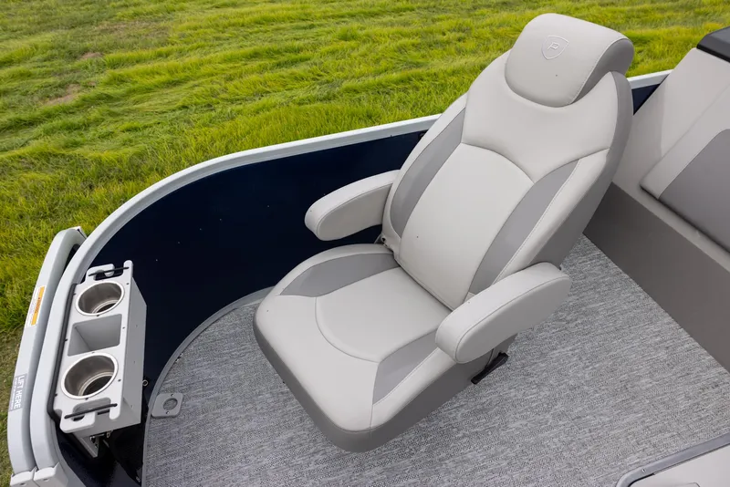 Slide: The Image of Luxurious seating on 2025 Premier 230 SunSation Angler boat with cup holders, gray upholstery. - 4