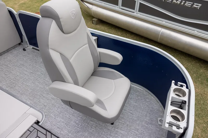 Slide: The Image of 2025 Premier 230 SunSation Angler boat seat with cup holders, gray upholstery. - 5