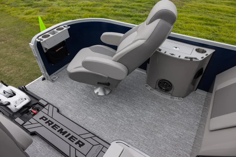 Slide: The Image of 2025 Premier 230 SunSation Angler boat interior with gray seating and carpet. - 6