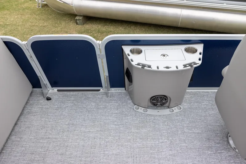 Slide: The Image of 2025 Premier 230 SunSation Angler boat interior with cup holders and speaker. - 7