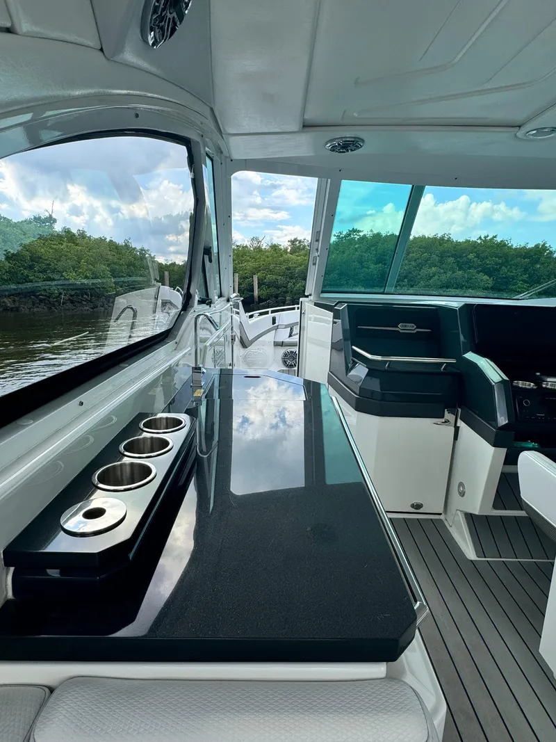 Slide: The Image of Interior of 2021 Formula 380 Super Sport Crossover OB with sleek countertops and seating. - 11