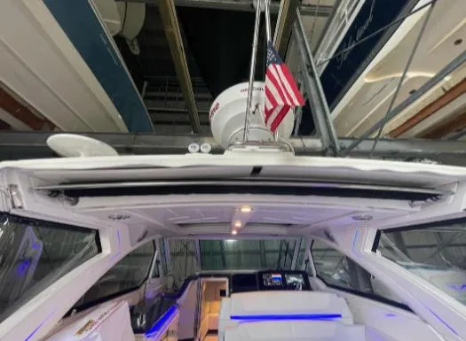 Slide: The Image of 2021 Formula 380 Super Sport Crossover OB interior with American flag and modern design. - 17