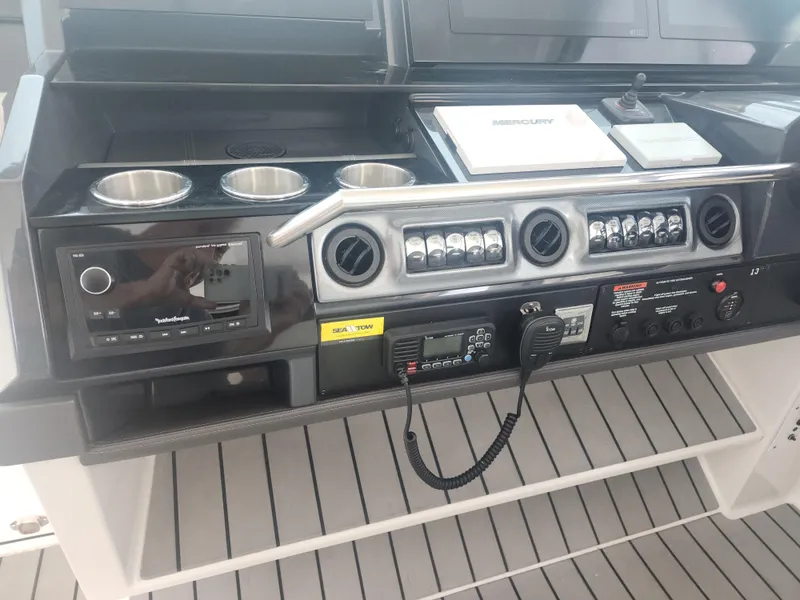 Slide: The Image of Control panel of 2021 Formula 380 Super Sport Crossover OB boat with audio and navigation systems. - 21