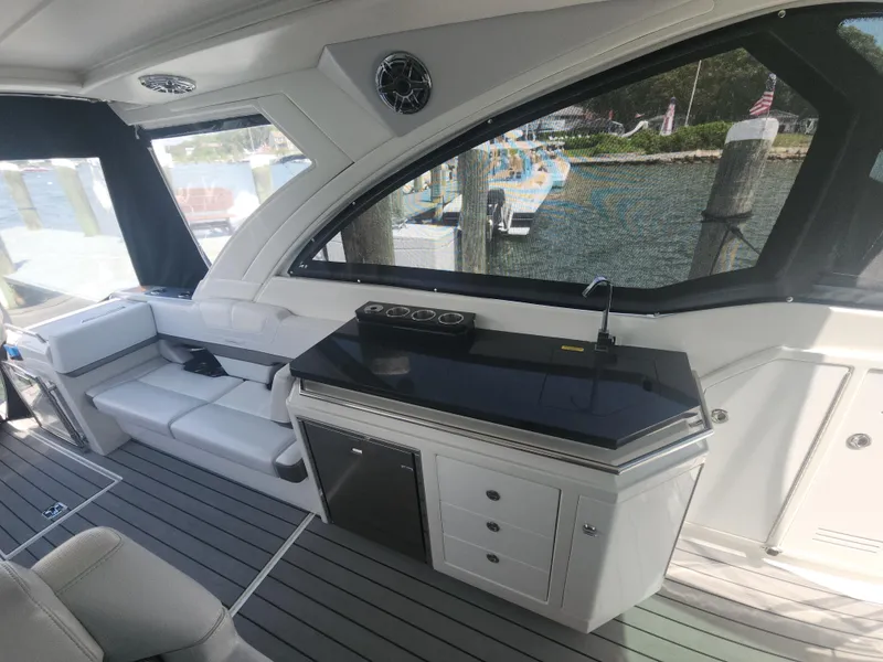 Slide: The Image of 2021 Formula 380 Super Sport Crossover OB interior with seating and kitchenette. - 30