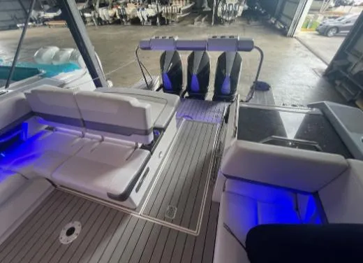 Slide: The Image of 2021 Formula 380 Super Sport Crossover OB with sleek seating and ambient blue lighting. - 34