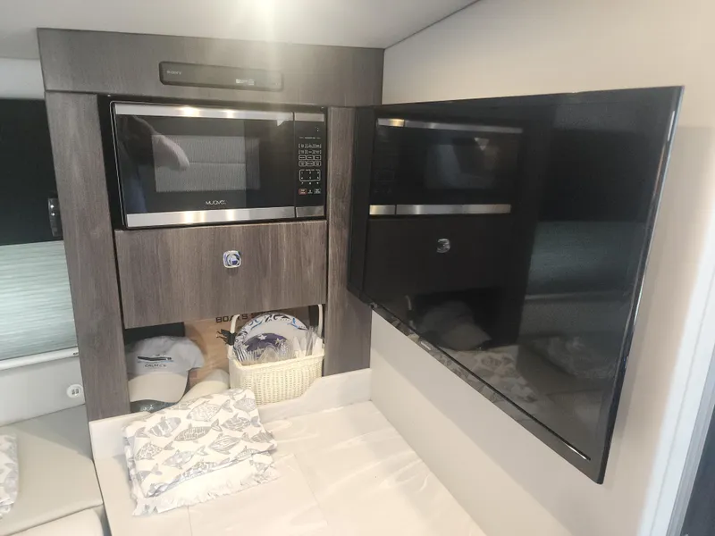 Slide: The Image of Interior of 2021 Formula 380 Super Sport Crossover OB with microwave and TV. - 39