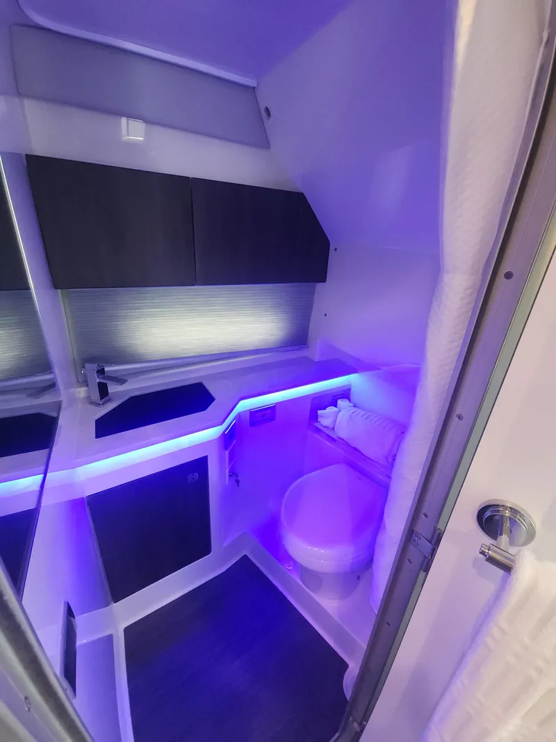 Slide: The Image of Modern bathroom in 2021 Formula 380 Super Sport Crossover OB with ambient lighting. - 40